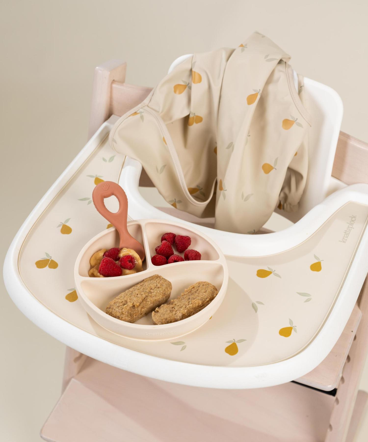 Haklapp med ärm & vattenavvisande ficka - Sunny pear Knatteplock